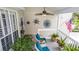Charming covered front porch with comfortable seating, lush landscaping, and decorative accents at 275 Bayou Cir, Debary, FL 32713