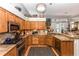 Well-equipped kitchen featuring stainless steel appliances and granite countertops and backsplash at 275 Bayou Cir, Debary, FL 32713