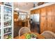 Open kitchen area with stainless steel appliances, ample cabinets, and a view of the dining area at 275 Bayou Cir, Debary, FL 32713