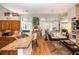 Bright living room with hardwood floors, tan granite countertops and an open floor plan concept at 275 Bayou Cir, Debary, FL 32713