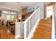 Open-concept living room featuring hardwood floors, a fireplace, and lots of natural light at 275 Bayou Cir, Debary, FL 32713