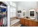 Well-lit bathroom boasts double sinks, granite countertops, and a tiled tub with jacuzzi jets at 275 Bayou Cir, Debary, FL 32713