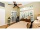 Bright main bedroom features hardwood floors, and large windows with stylish white shutters at 275 Bayou Cir, Debary, FL 32713