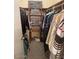 Walk-in closet with built-in shelves and hanging rods, offering ample storage space for clothes and accessories at 2898 Ocean Shore Blvd # 603, Ormond Beach, FL 32176