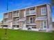 A well-maintained building with multiple units, featuring balconies and green space at 2898 Ocean Shore Blvd # 603, Ormond Beach, FL 32176
