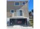 Condo exterior with a ground-level garage and an above deck with sliding glass doors at 2898 Ocean Shore Blvd # 603, Ormond Beach, FL 32176