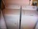 A utility room with a washing machine and dryer, providing convenient laundry facilities within the home at 2898 Ocean Shore Blvd # 603, Ormond Beach, FL 32176