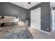 Serene bedroom featuring a bed with storage, soft lighting, and a neutral color scheme for a peaceful retreat at 2948 Bella Flore Ter, New Smyrna Beach, FL 32168