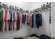 This walk-in closet has custom racks for shoes, clothes and accessories at 2948 Bella Flore Ter, New Smyrna Beach, FL 32168
