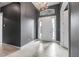 Inviting foyer with white tiled floor, neutral walls, and a stylish chandelier fixture at 2948 Bella Flore Ter, New Smyrna Beach, FL 32168
