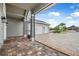 Covered patio with brick pavers looking towards the three-car garage at 2948 Bella Flore Ter, New Smyrna Beach, FL 32168