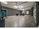 Spacious garage with epoxy floor, golf cart and sliding door access to back yard at 2948 Bella Flore Ter, New Smyrna Beach, FL 32168