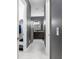 This hallway leads to a full bath and walk-in closet from the main bedroom at 2948 Bella Flore Ter, New Smyrna Beach, FL 32168