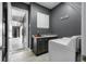 Laundry room with garage access, offering convenience and functionality with modern appliances at 2948 Bella Flore Ter, New Smyrna Beach, FL 32168