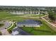 Aerial shot showing a home with a screened pool, fenced backyard, and golf course views at 2948 Bella Flore Ter, New Smyrna Beach, FL 32168