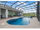 Stylish screened-in pool and patio area with comfortable seating, and views of the community at 2948 Bella Flore Ter, New Smyrna Beach, FL 32168