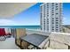 Balcony with table, chairs, and ocean views, perfect for outdoor relaxation and enjoying the scenery at 2987 S Atlantic Ave # 901, Daytona Beach, FL 32118