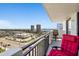 Balcony with table, chairs, and city views, overlooking the beach and city buildings at 2987 S Atlantic Ave # 901, Daytona Beach, FL 32118