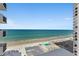 Beautiful beach view, showcasing the shoreline, swimming pool, beachgoers, and ocean waves from a high vantage point at 2987 S Atlantic Ave # 901, Daytona Beach, FL 32118