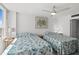 Cozy bedroom featuring two beds and a ceiling fan, creating a relaxing space at 2987 S Atlantic Ave # 901, Daytona Beach, FL 32118