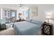 Comfortable bedroom with balcony access, complemented by a stylish desk and chair setup at 2987 S Atlantic Ave # 901, Daytona Beach, FL 32118