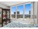 Bedroom with a large window that provides views of the city skyline and the adjacent waters at 2987 S Atlantic Ave # 901, Daytona Beach, FL 32118