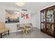 Cozy dining area featuring a glass table with 4 chairs next to an accent cabinet at 2987 S Atlantic Ave # 901, Daytona Beach, FL 32118