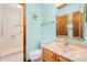 Bright bathroom features a walk-in shower, a modern vanity, and beach-themed decor at 3035 Victory Palms Dr, Edgewater, FL 32141