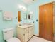 Cozy bathroom with a single vanity and neutral-toned decor and modern toilet at 3035 Victory Palms Dr, Edgewater, FL 32141