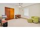 Versatile bedroom space with a chair, desk and ceiling fan at 3035 Victory Palms Dr, Edgewater, FL 32141