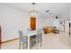 Open concept living area with dining area and view into the living room at 3035 Victory Palms Dr, Edgewater, FL 32141