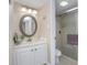 Bright bathroom with a shower and vanity provides residents with comfortable privacy at 3043 S Atlantic Ave # 204, Daytona Beach, FL 32118