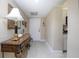 Hallway with decorative table leading to front door at 3043 S Atlantic Ave # 204, Daytona Beach, FL 32118