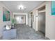 Hallway with elevators and seating area at 3043 S Atlantic Ave # 204, Daytona Beach, FL 32118