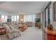 This living room features neutral-toned furniture and ample natural light, perfect for relaxing at 3043 S Atlantic Ave # 204, Daytona Beach, FL 32118