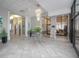 Modern lobby area with a chandelier, plants, and elevator access at 3043 S Atlantic Ave # 204, Daytona Beach, FL 32118