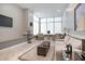 Resident lounge with plush seating, ottomans, and large windows, perfect for relaxing with friends at 3043 S Atlantic Ave # 204, Daytona Beach, FL 32118