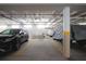View of the parking garage with assigned spaces for cars and bicycles at the condominium complex at 3043 S Atlantic Ave # 204, Daytona Beach, FL 32118