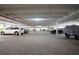 Wide angle photo of the parking garage with assigned parking and overhead lighting at 3043 S Atlantic Ave # 204, Daytona Beach, FL 32118