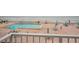 Oceanfront community pool with plenty of lounge chairs and umbrellas on a brick-paved deck at 3043 S Atlantic Ave # 204, Daytona Beach, FL 32118