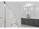 A renovated bathroom with tiled floors and walls with a gray vanity and vessel sink at 3047 S Atlantic Ave # 1805, Daytona Beach, FL 32118