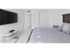 A large bed in a large bedroom, with a view of the hallway and closet at 3047 S Atlantic Ave # 1805, Daytona Beach, FL 32118