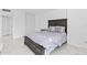 Spacious bedroom with a large bed, featuring white and gray tones and marble floors at 3047 S Atlantic Ave # 1805, Daytona Beach, FL 32118