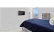Comfortable bedroom with large window overlooking ocean view and a flat screen tv at 3047 S Atlantic Ave # 1805, Daytona Beach, FL 32118
