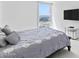 Bright bedroom features a large window with a scenic water view and a mounted television at 3047 S Atlantic Ave # 1805, Daytona Beach, FL 32118
