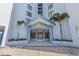Exterior view of the building entrance with landscaping at 3047 S Atlantic Ave # 1805, Daytona Beach, FL 32118