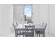 Cozy dining area with a modern gray table and chairs, with a view of the city at 3047 S Atlantic Ave # 1805, Daytona Beach, FL 32118
