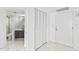 Hallway with a door to the bathroom, closet, and the main door at 3047 S Atlantic Ave # 1805, Daytona Beach, FL 32118