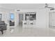 Modern open-concept kitchen with sleek cabinetry, bar seating, and beautiful marble flooring at 3047 S Atlantic Ave # 1805, Daytona Beach, FL 32118