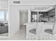 Bright and modern kitchen area featuring counter seating and stainless steel appliances at 3047 S Atlantic Ave # 1805, Daytona Beach, FL 32118